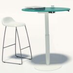 mesa redonda elevable en altura metal y laminado.